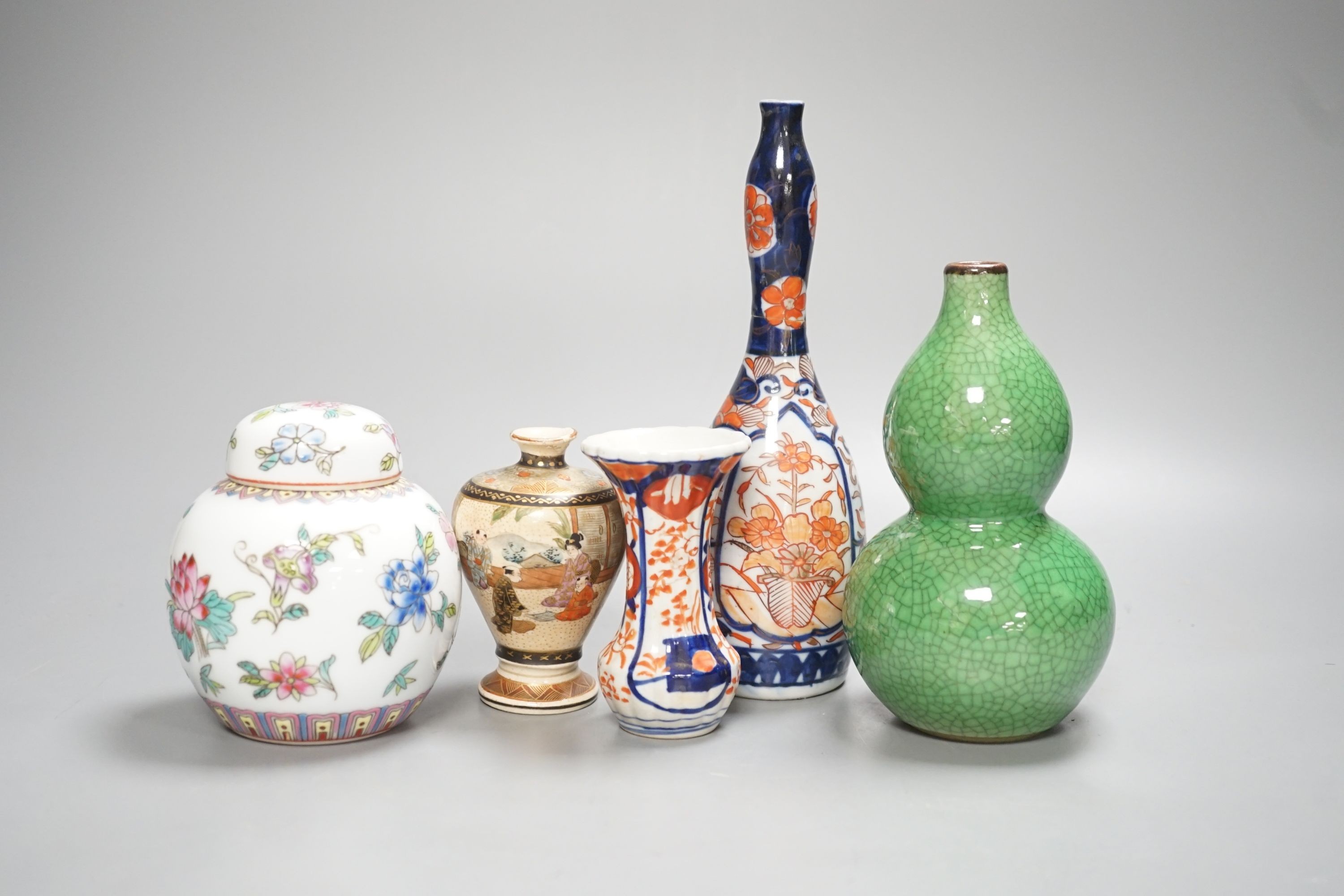 A Chinese green double gourd crackleware vase, a famille rose jar and cover and two Japanese vases, tallest 19.5cm (5)